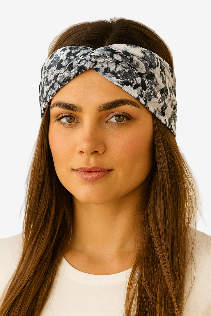 Woman wearing a patterned headband against a white background