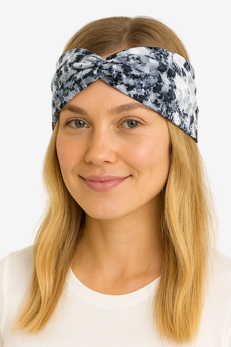 Woman wearing a patterned headband on a white background