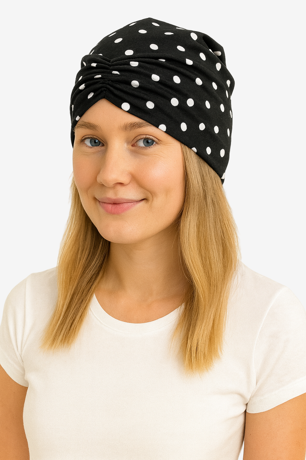 Woman wearing a black headscarf with white polka dots on a white background
