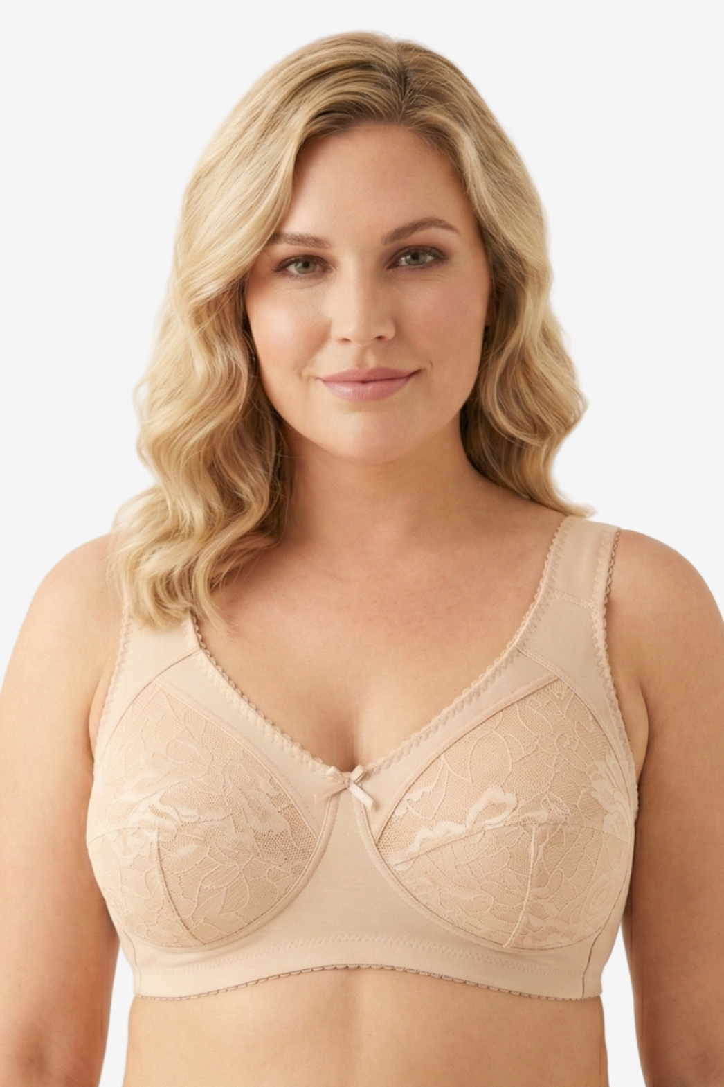 Woman wearing a beige bra against a plain background