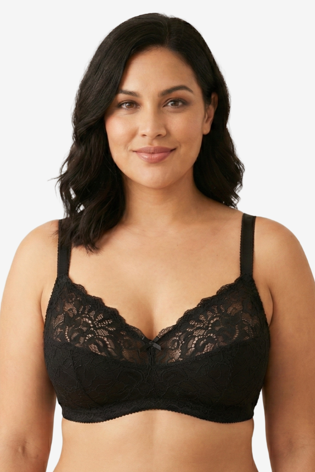 Woman wearing a black lace bra against a plain background