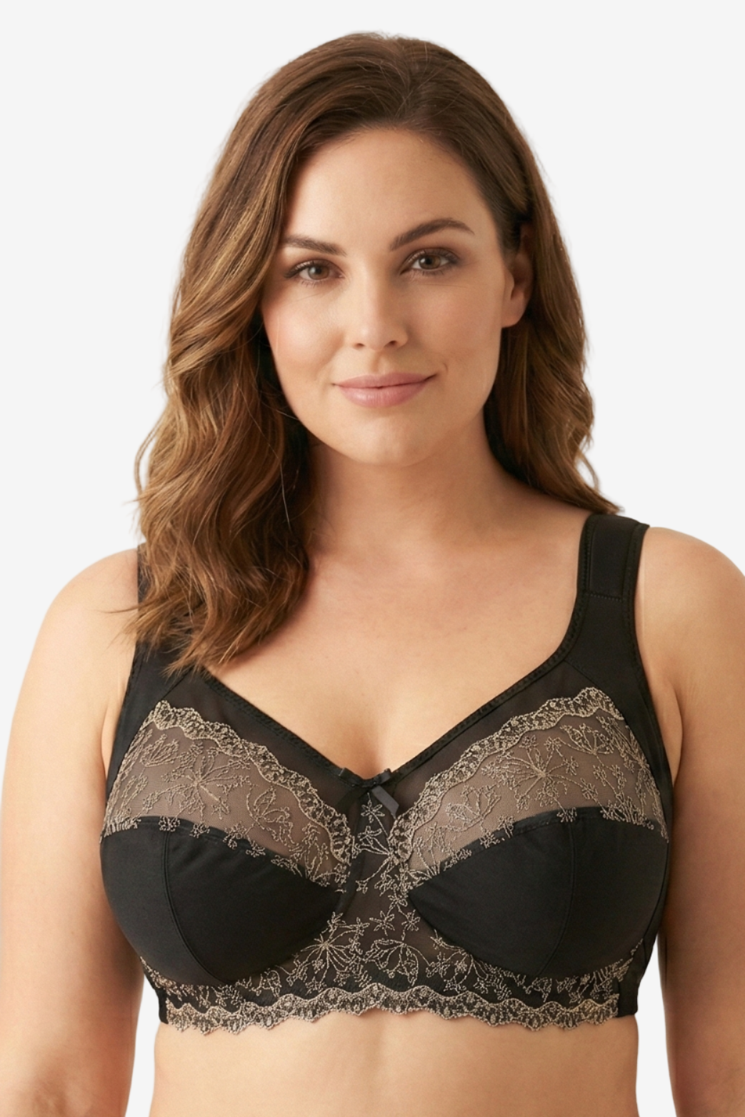 Woman wearing a black lace bralette on a beige background